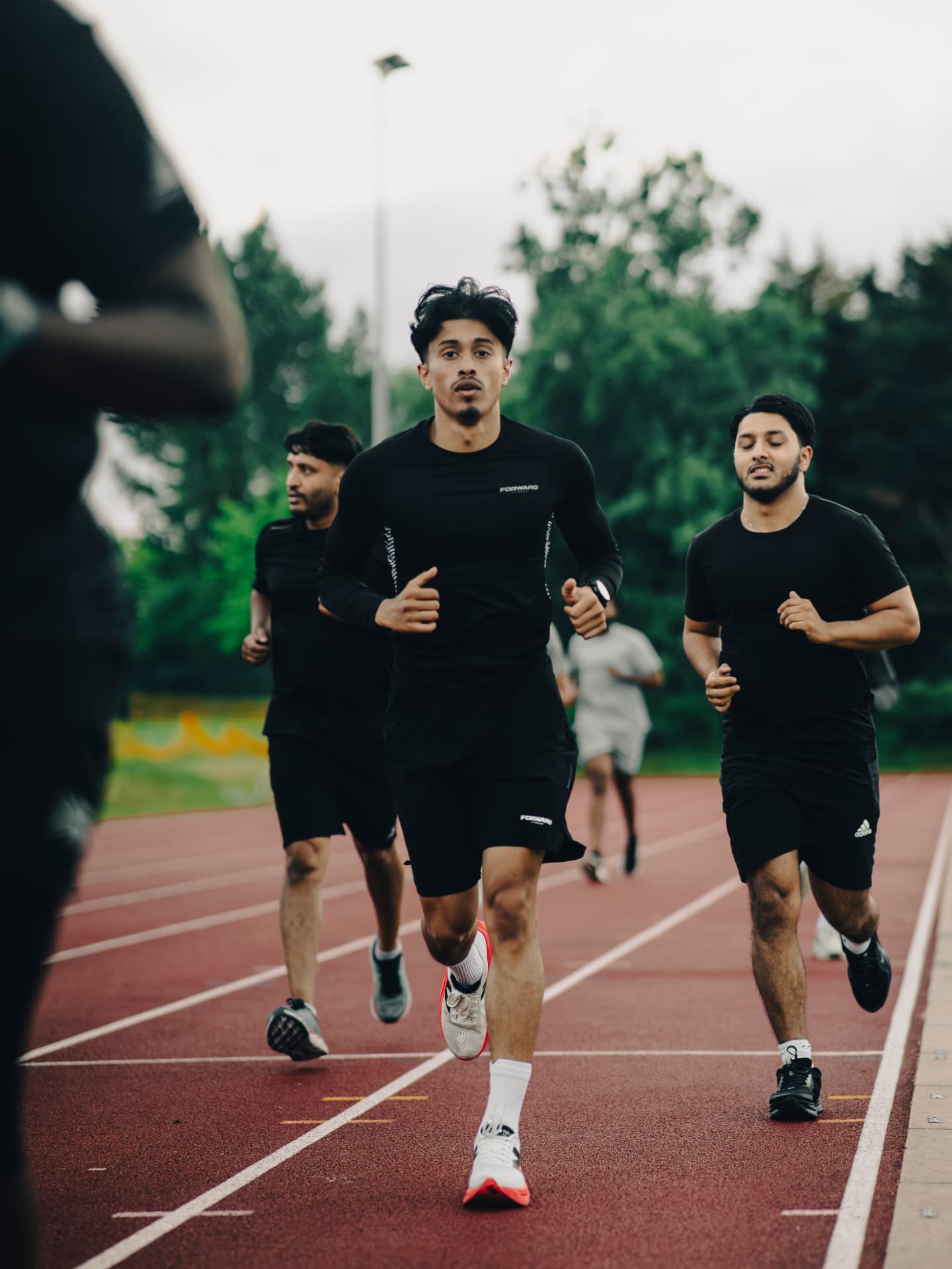 Group running on the athletics track