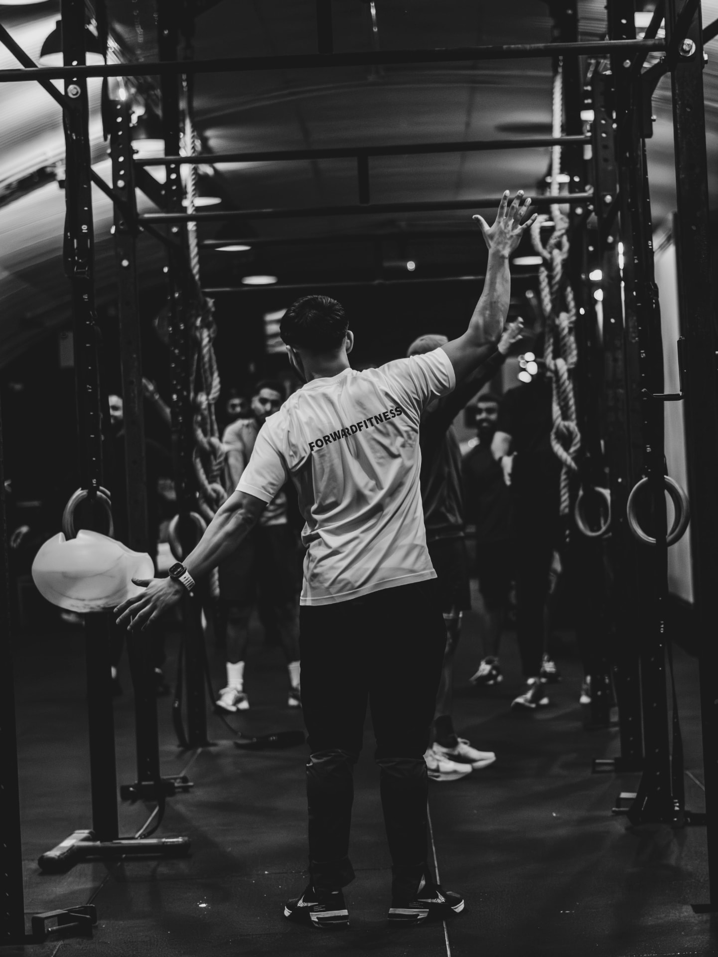 Coach leading from the front of the gym