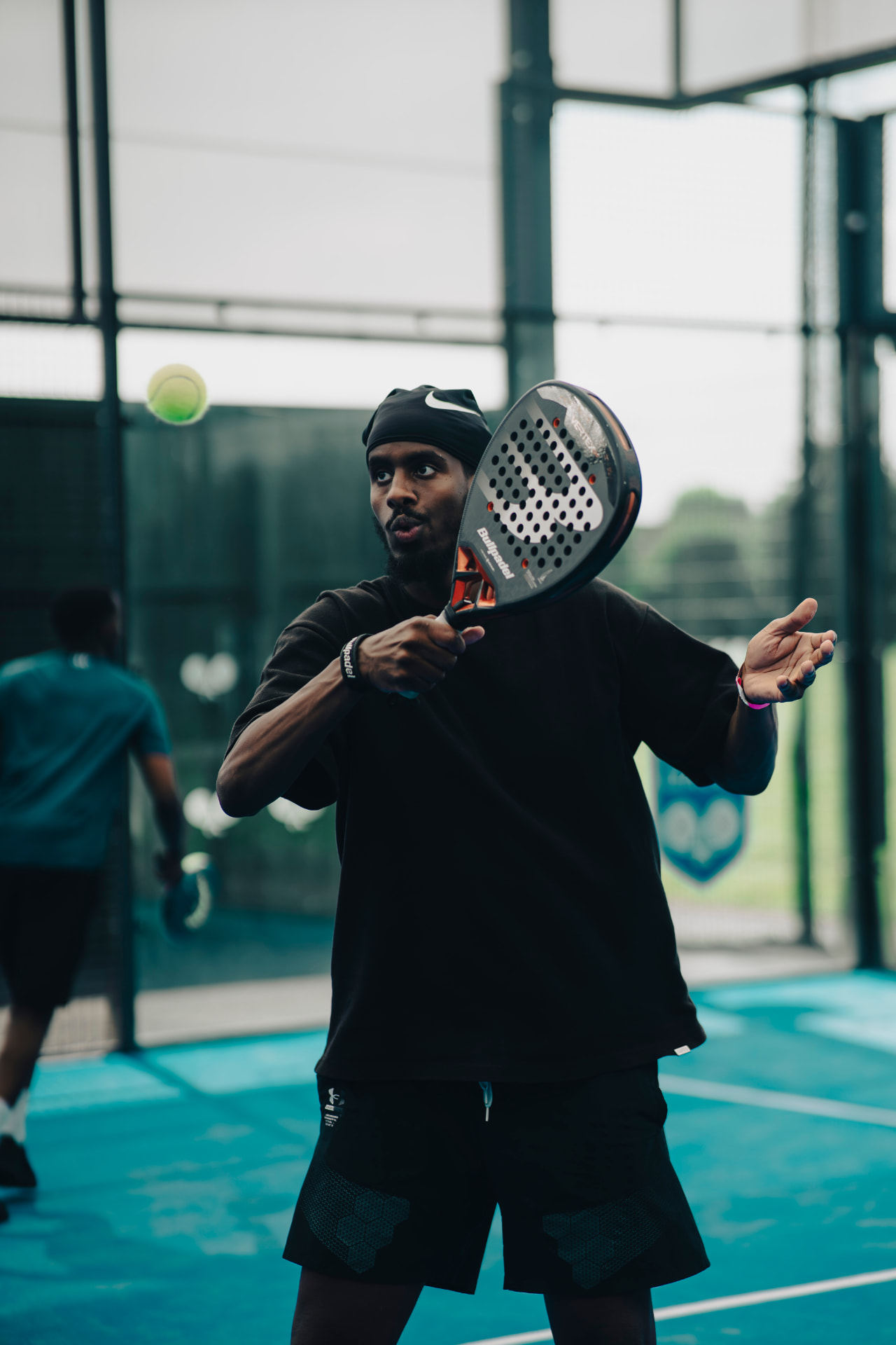 Padel player focused on the next shot