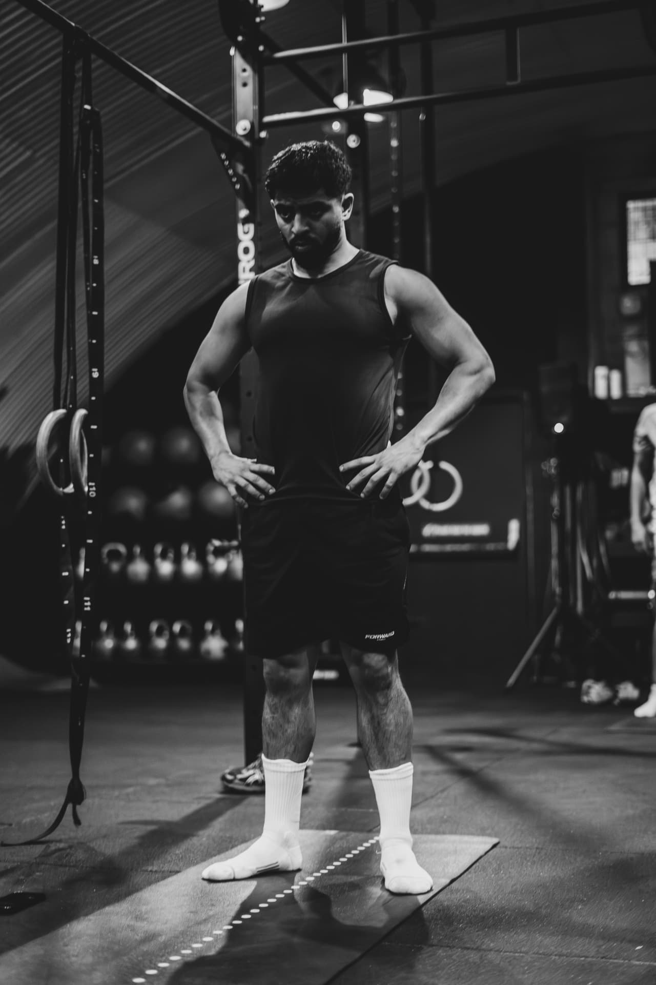 Member standing ready on the gym floor