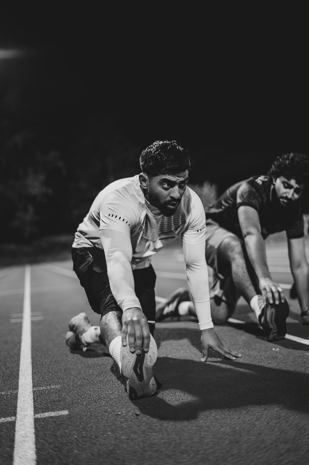 Athletes stretching on the track