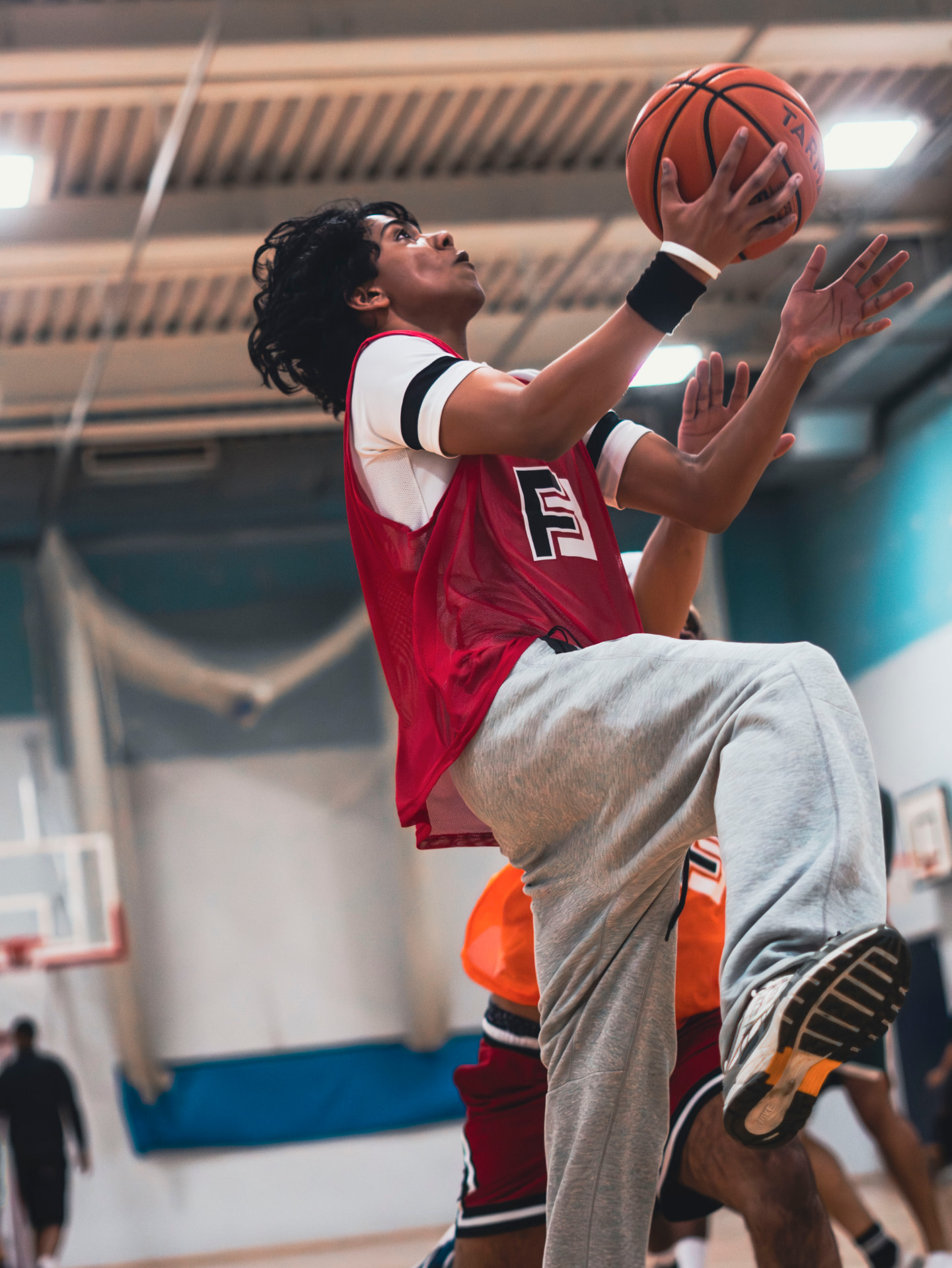 Basketball player finishing at the rim